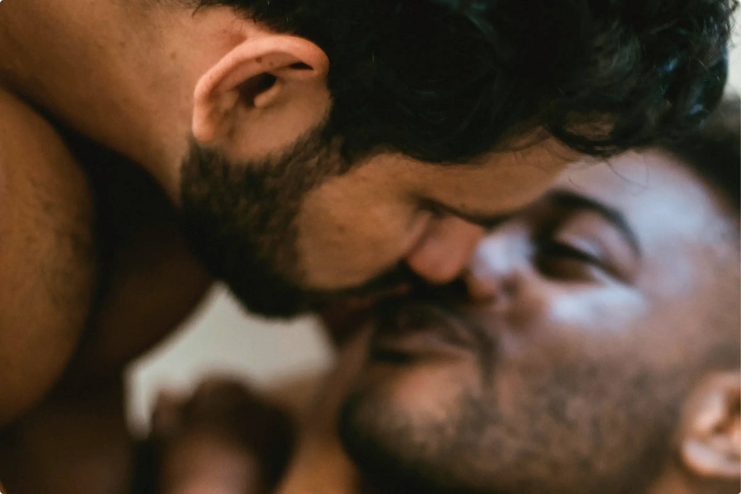 Two men kissing 