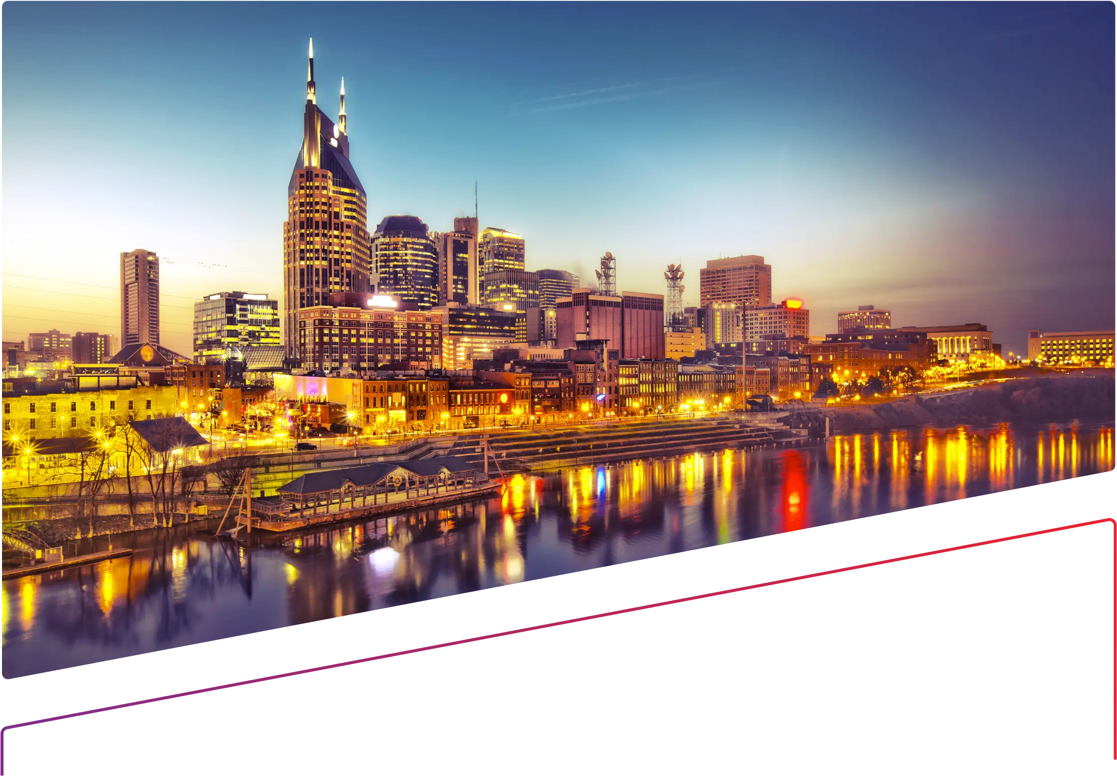 A night time view of the Nashville skyline from the river 